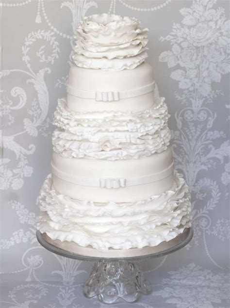 White Ruffles And Bows Wedding Cakes