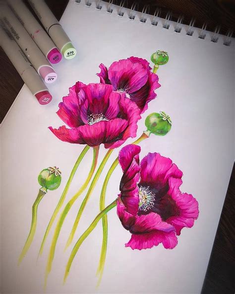 Three Pink Flowers With Green Stems On A Sheet Of Paper Next To Markers