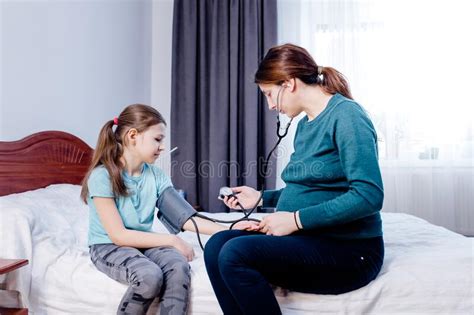 Mother Controls Her Child Blood Pressure Stock Photos Free And Royalty