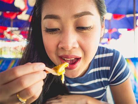 Premium Photo Close Up Of Asian Woman Eating Local Grilled Seafood Of Thailand Beach