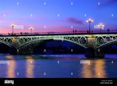 Triana Bridge At Dusk Seville Andalusia Spain Stock Photo Alamy