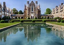 a large building with a pool in front of it