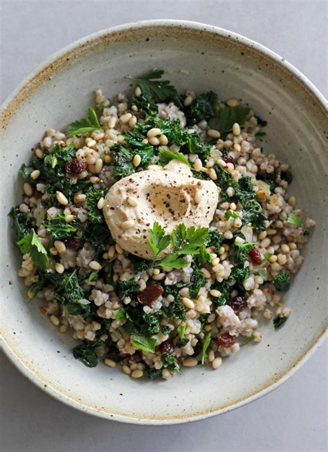 sautéed buckwheat kale raisins and pine nuts with creamy hummus dish magazine