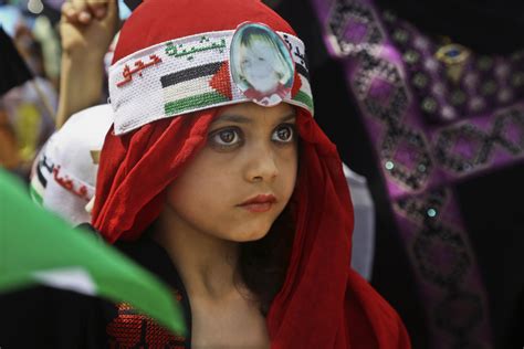 Portrait Of A Palestinian Girl Dressed In Traditional Clothing In The