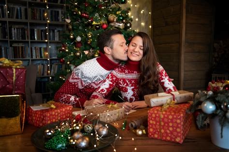 Free Photo Couple Giving Each Other Christmas Ts