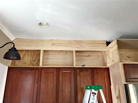 This kitchen cart offers a large work space + ample storage. Building Cabinets up to the Ceiling from Thrifty Decor Chick