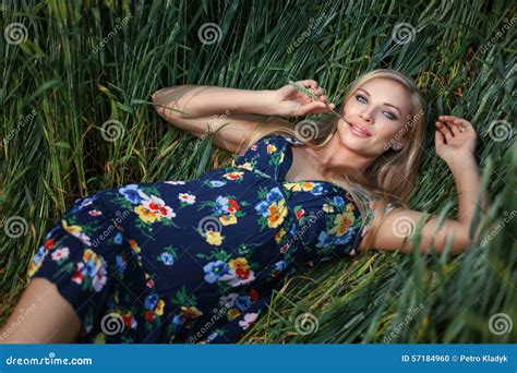 Blond Girl Lying In The Grass And Smiling Stock Photo Image Of