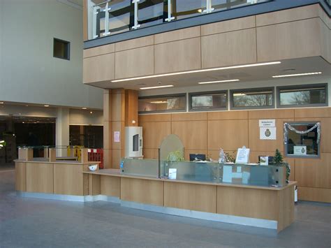 Local Hospital Main Reception Desk In Beech Veneer And Panel Effect