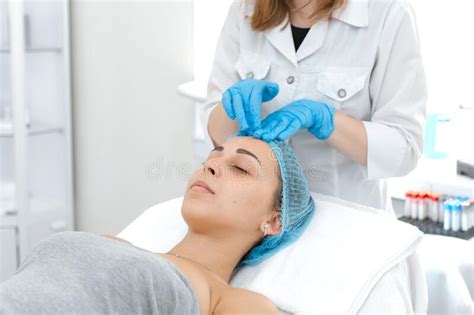 Beautician Makes A Young Beautiful Girl A Relaxing And Wellness Facial