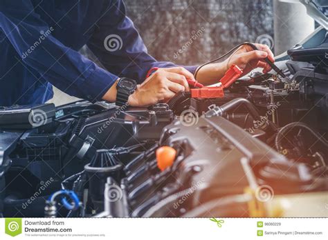Hands Of Car Mechanic Working In Auto Repair Service Stock Image
