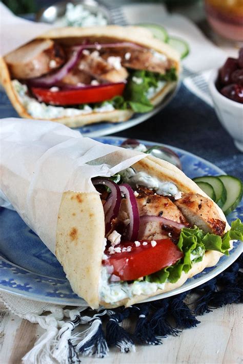 The combination of juicy greek lemon chicken, creamy cucumber dill tzatziki, fresh crisp veggies, and tangy feta wrapped in warm pita bread is out of this world. Grilled Chicken Gyro Recipe - The Suburban Soapbox