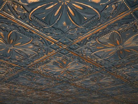 Original tin ceiling tiles cost at least six times more than that and cannot be easily cut to fit like these can. Faux tin ceiling tile TD10 Graphite Gold - a need for the ...