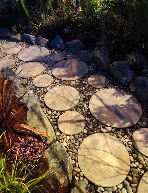 Round Pavers In River Rock Pebble Landscaping Landscaping With Rocks