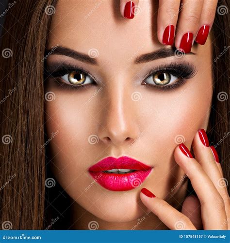 Seductive Woman With Dark Brown Eye Makeup And Bright Red Lips And Nails Stock Image Image Of