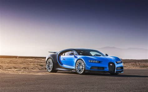 Download Blue Sports Car Desert Road Wallpaper