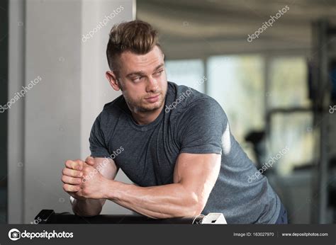 Muscular Man After Exercise Resting In Gym Stock Photo By ©ibrak 163027970