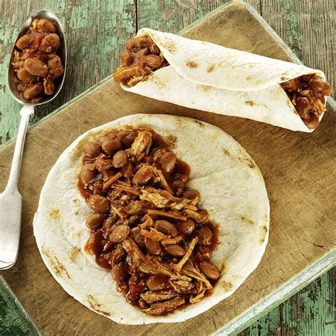 An easy, hearty and delicious dish, with pork shoulder, cooked low and slow, together with pinto beans, all in a baked bean like sauce. Enjoy this shredded pork recipe, with vegetables and beans, that lets the slow cooker do all the ...