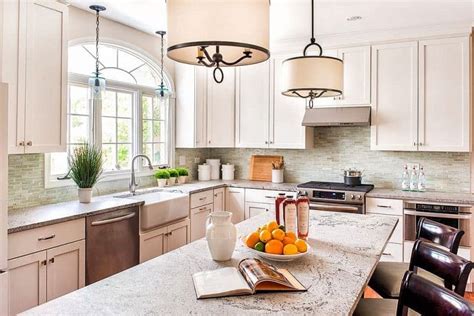 Modern pendant lights, suspended over a kitchen island or bar, are almost always a winning design element—and instant kitchen focal point. 27 Cheerful Kitchen Ideas | Décor Outline