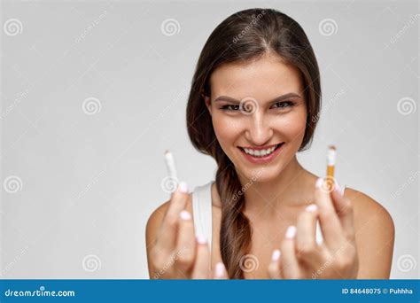 Quit Smoking Beautiful Happy Woman Holding Broken Cigarette Stock