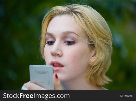 Beautiful Yong Blonde Girl With Blue Eyes Putting On Makeup Free