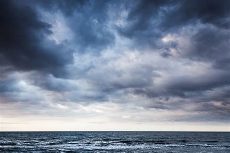 Dramatic Stormy Dark Cloudy Sky Over Sea Stock Photo Download Image