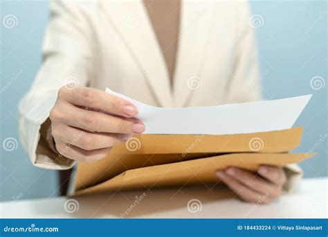 Attractive Businesswoman Hand Open Business Report From Document