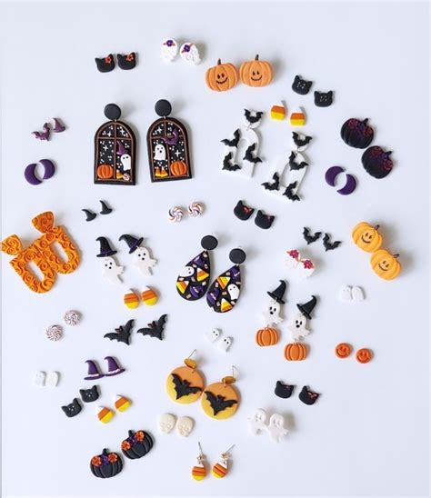 A Collection Of Halloween Decorations On A White Surface Including