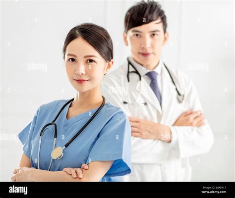 Two Smart And Professional Smiling Doctors Stock Photo Alamy