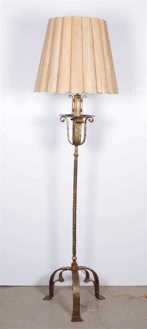 This one is a reproduction. 19th Century French Gilt Wrought Iron Floor Lamp at 1stdibs