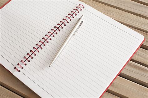 Free Stock Photo 10819 Open Blank Notebook With Ballpoint Pen On Top