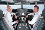 Germany, Bavaria, Munich, Pilot and co-pilot piloting aeroplane from ...
