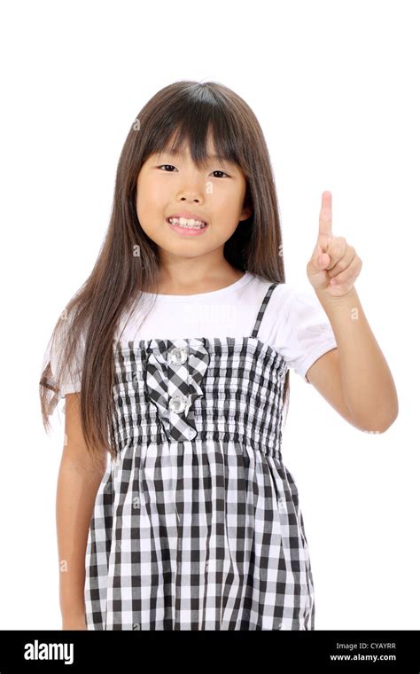 Smiling Little Asian Girl Rise Hand And Pointing Stock Photo Alamy
