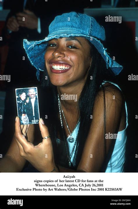 July 26 2001 Aaliyahsigns Copies Of Her Latest Cd For Fans At The