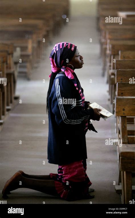 Woman Praying On Her Knees In A Catholic Church In Maiduguri Nigeria