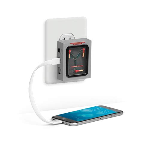An Electronic Device Plugged In To A Wall Charger With A Phone
