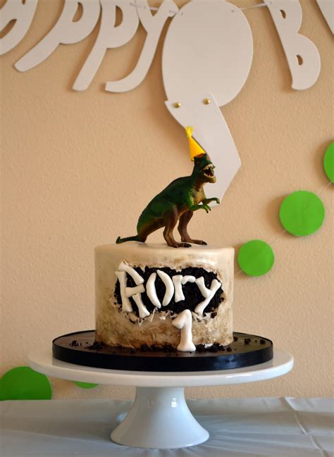 Dinosaur lovers will love this cake with a cool waterfall! Dinosaur Birthday Party Ideas - Littles, Life, & Laughter