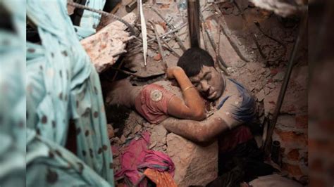 haunting photo of bangladesh couple in final embrace after building collapse goes viral