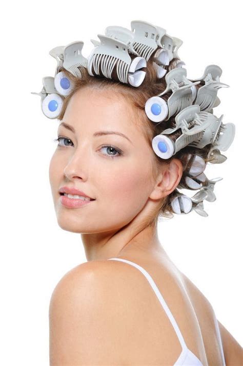 pin on curlers in her hair