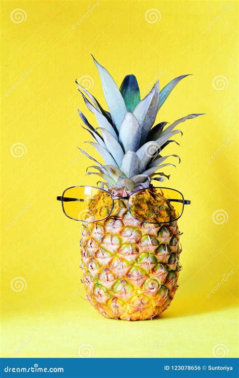 Pineapple With Sunglasses Yellow On A Yellow Background Beach And