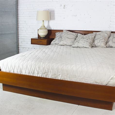 Platform beds with attached nightstands make a great centerpiece for your bedroom. Vintage Scandinavian Modern Teak King Platform Bed with Attached Night Stands - warehouse 414