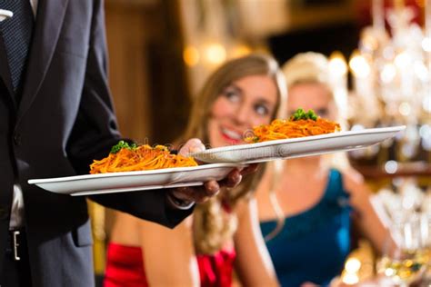 Waiter Served Dinner In A Fine Restaurant Stock Photo Image Of Dress