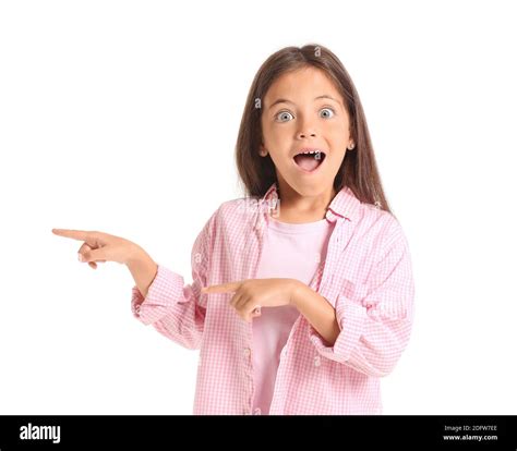 Surprised Little Girl Pointing On Something On White Background Stock