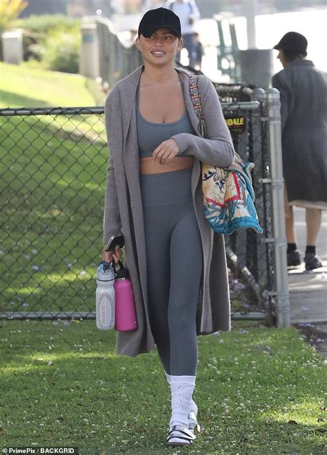 Chrissy Teigen Shows Off Her Taut Abs In Sports Bra And Leggings