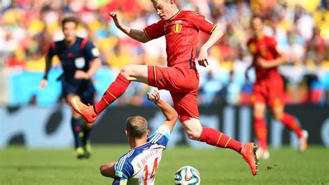 * only players with total appearances greater than the average number of appearances in world cup 2014 are displayed. Kevin De Bruyne of Belgium is tackled by Vasily ...