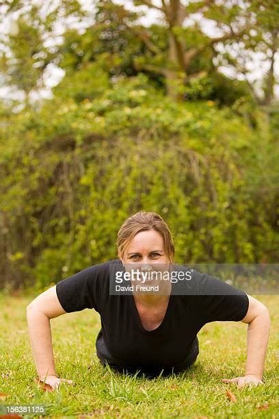 Woman Doing Pushups On Grass Photos And Premium High Res Pictures