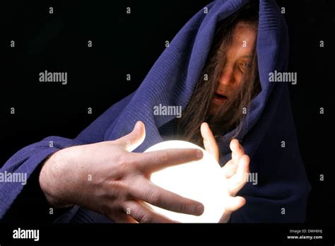 Wizard With Glowing Magical Orb Close Up Stock Photo Alamy