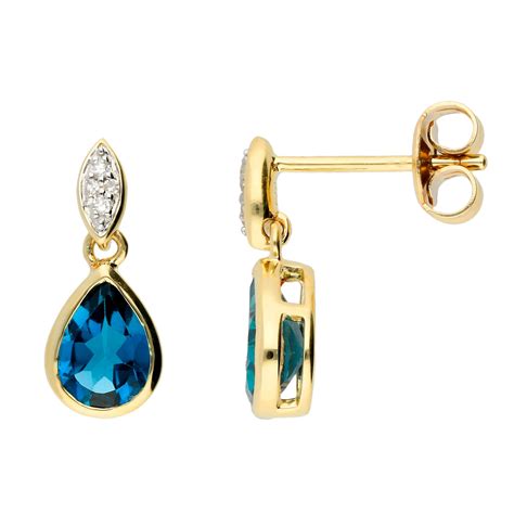 9ct Gold London Blue Topaz Diamond Drop Earrings Buy Online Free
