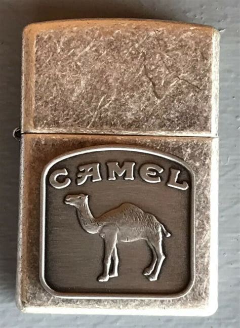 This lighter requires fluid fuel. 1998 Zippo Camel Emblem Antique Silver Plate Lighter In ...
