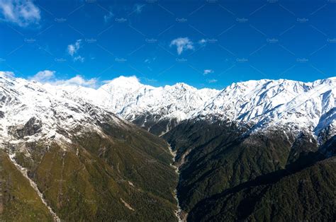 Aerial View Of New Zealand Mountains With River Wilderness Land