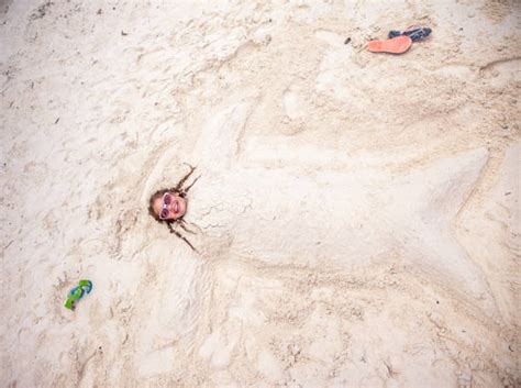 350 Child Buried In Sand Stock Photos Pictures And Royalty Free Images